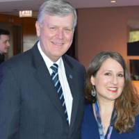 T.Haas smiles for a photo with alumna
